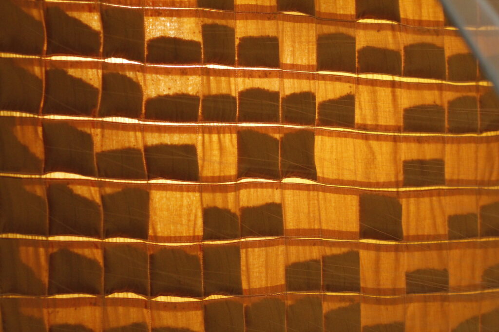 Detail of woven wheat and textile materials